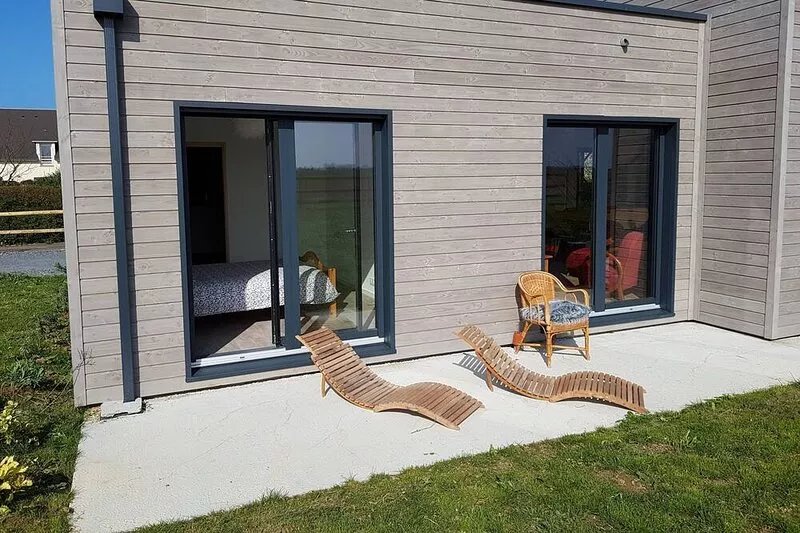 Modern wooden house in a seaside village, landing beaches