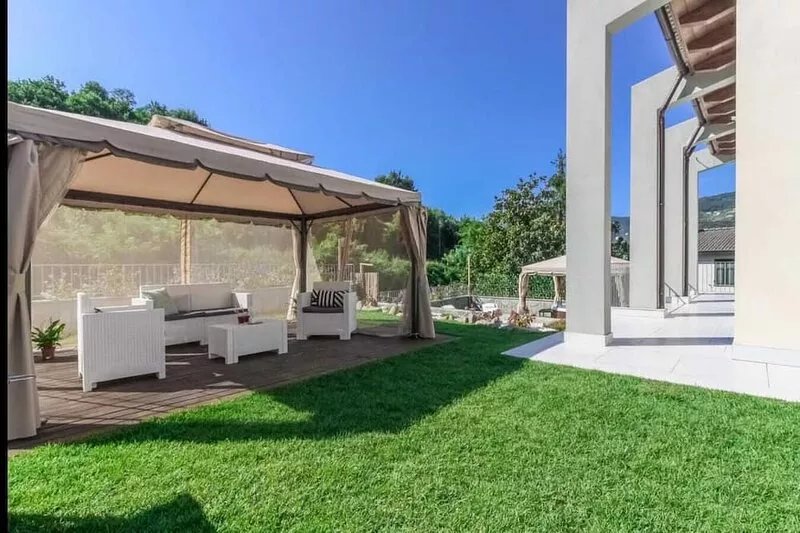Detached villa with outdoor hot tub, swimming pool and lawn
