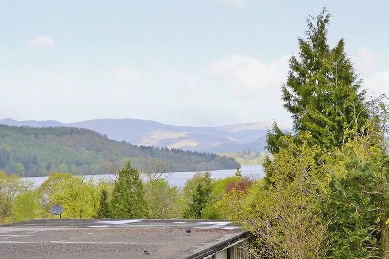 A contemporary first floor apartment with south facing balcony boasting lake