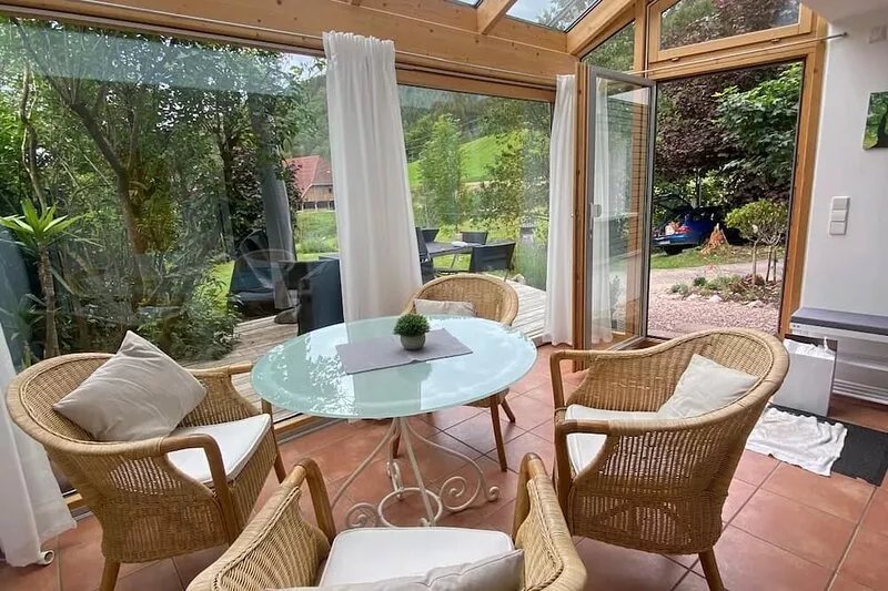 First floor apartment with bright conservatory, terrace, fireplace and WLAN