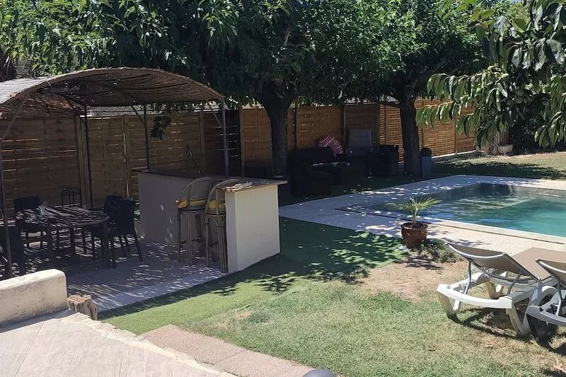 Stone house renovated in a contemporary style with garden and swimming pool.