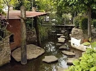 Architectural house from local wood and stone. Featured garden in Slieve Blooms.