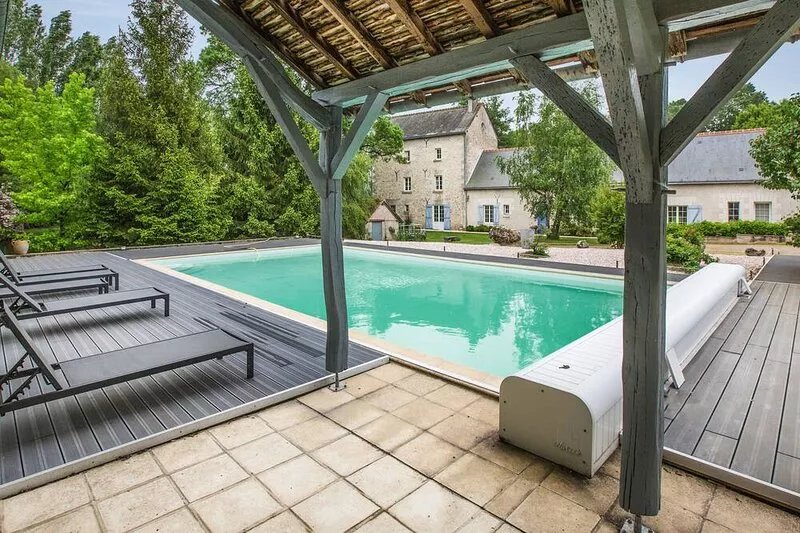 Old mill from the 19th century and its pond in the heart of the Châteaux of the