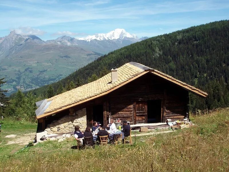 Typical Savoyard chalet with roof shingles, tufa walls and foist