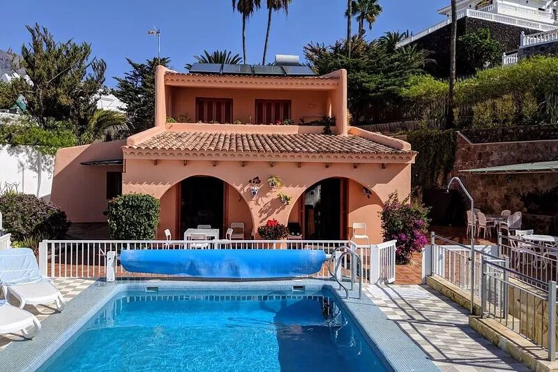 Luxury villa with private heated pool in private garden. Close to beaches.