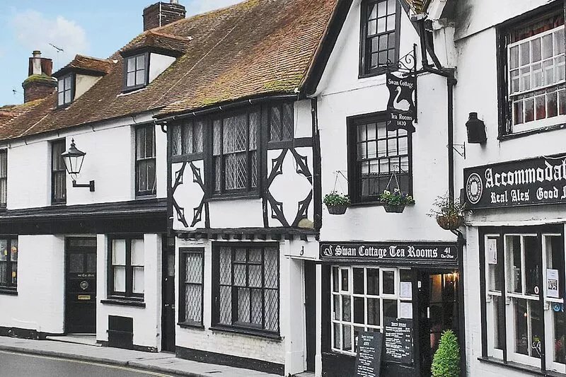 An unusual two storey apartment with beams and open fire.