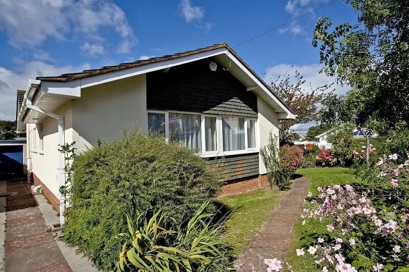 A family friendly retreat with large garden, close to a secluded cove.
