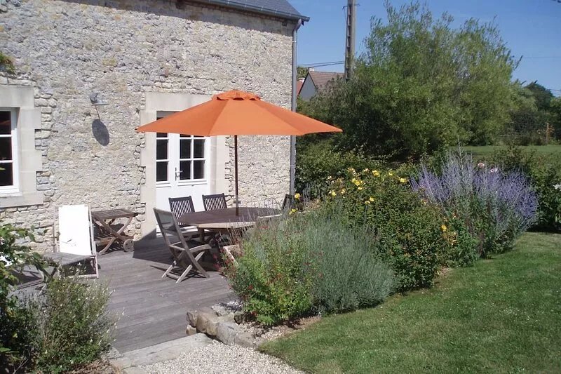 Stone cottage near Bayeux and D-Day sites, green and quiet.