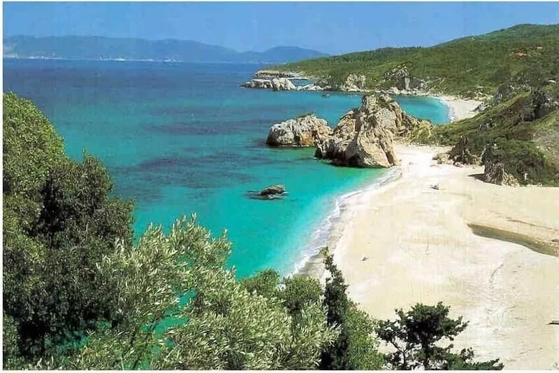 Stone house with stunning sea views and a beautiful pool in lush garden