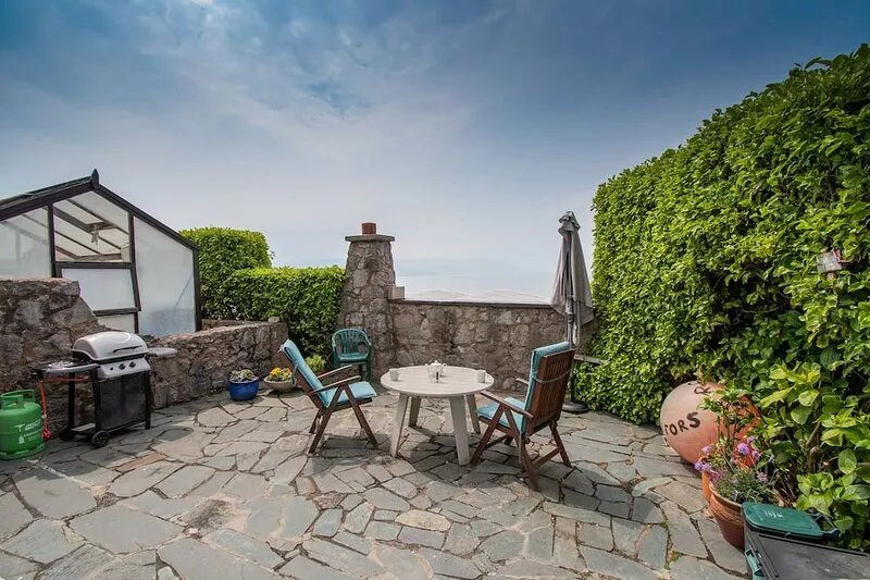 Exclusive beachside lodge with panoramic sea views and beach access.