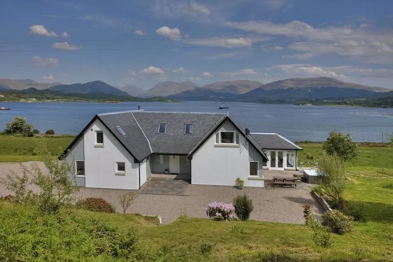 Luxury,large waterfront property with outdoor hot tub on shore of Scottish Loch.