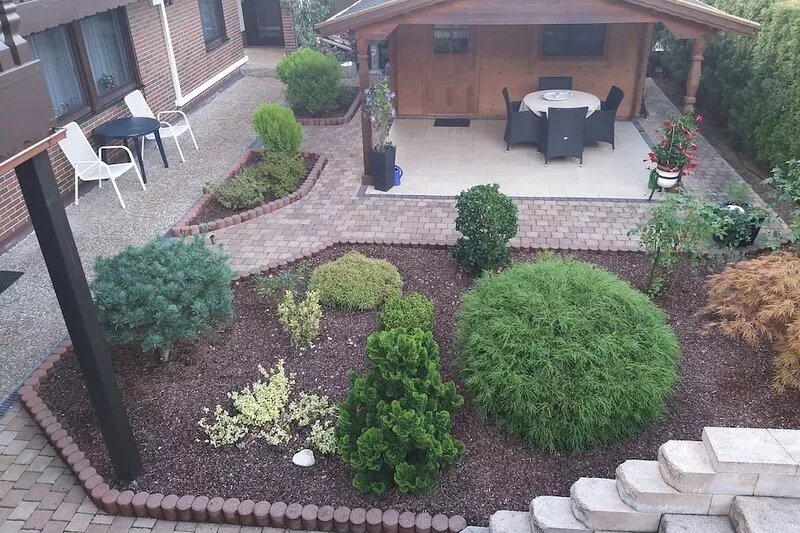 A 2 bedroom apartment with covered patio in the garden.