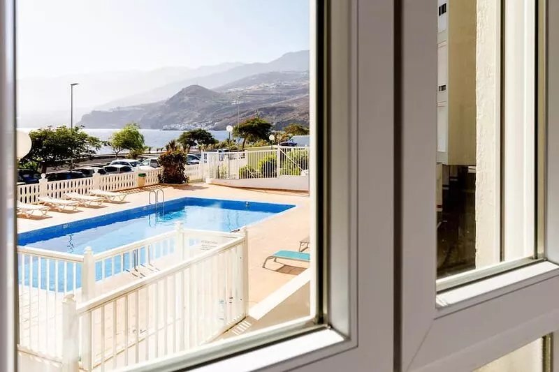 Spacious beachfront apartment with communal pool