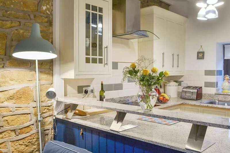 A cosy retreat with beamed ceilings and exposed stone work just a short walk