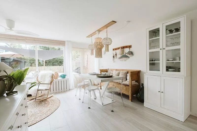 Stylish vacation home with bright furnishings and garden and terrace and porch.