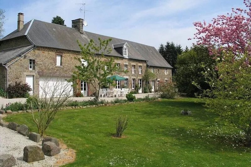 A stunning holiday house in Nomandy with large garden and heated pool.