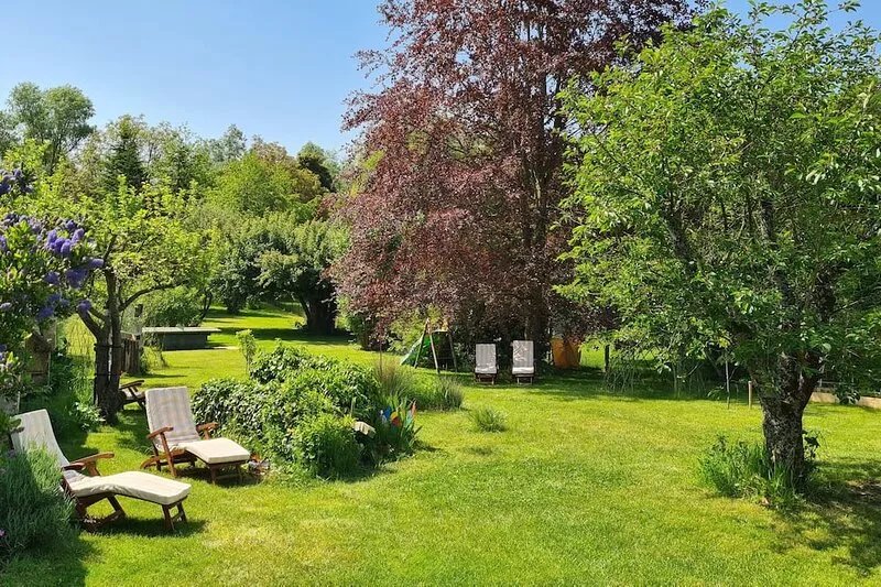Countryside house with river at the end of the garden