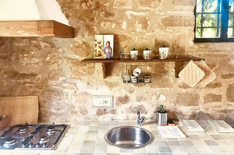 Small stone cottage in the woods, artists retreat, with pool