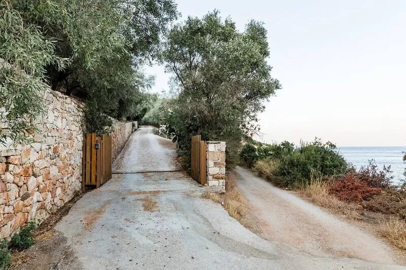Idyllic stone and wood villa with stunning, panoramic views of the Aegean Sea