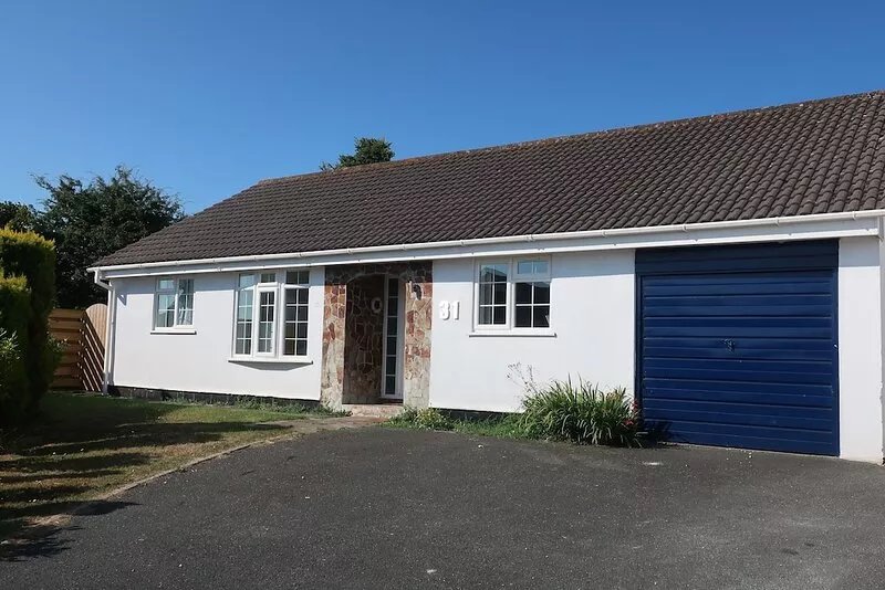 Lovely sunny bungalow near Rock, large secure garden, EV Charger on driveway