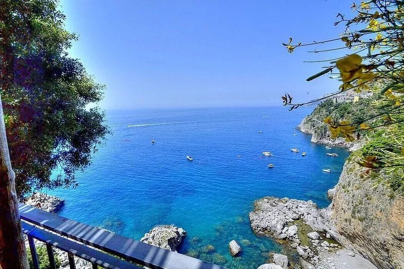 Villa Amaltea: A bright three-story villa built sheer above the sea, with Free