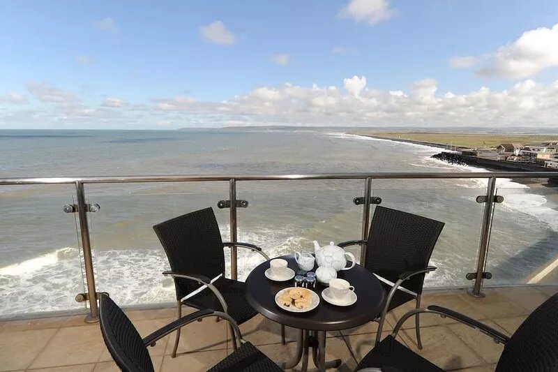Panoramic views over the beach from a stylish apartment in a landmark building.
