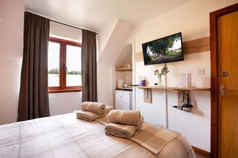 Double bedroom with a shared Bathroom and views over fields and country road