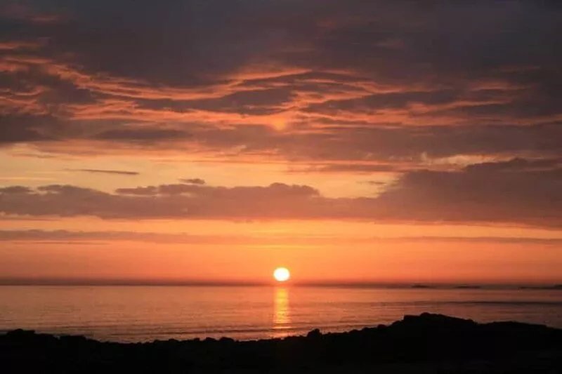 1930's bungalow nr Rhosneigr, opposite beach, large garden and amazing views.