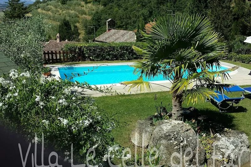 Villa in a hilly area surrounded by greenery with swimming pool and
