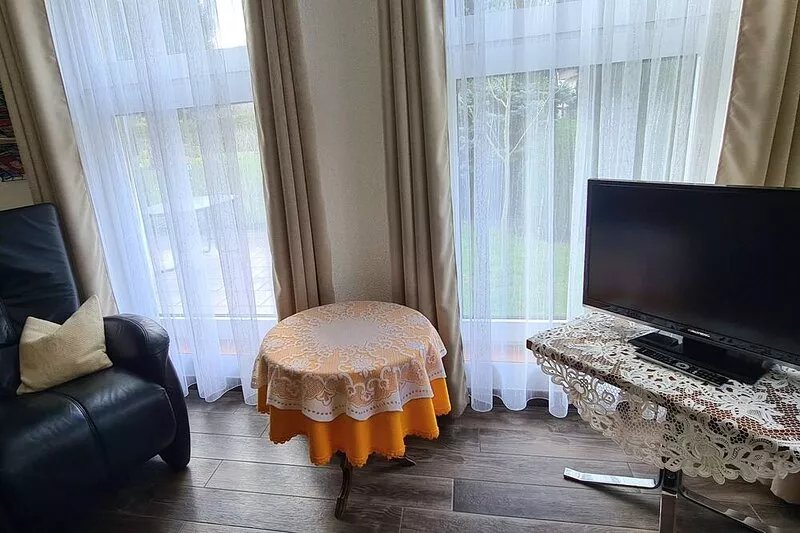 Centrally located vacation home in a garden with a parking space