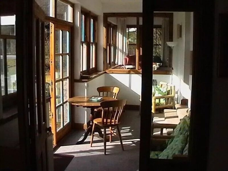 Beautiful centrally-heated house and sun-porch in large gardens facing South.