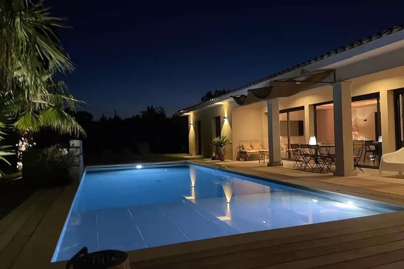 Contemporary house between sea and village