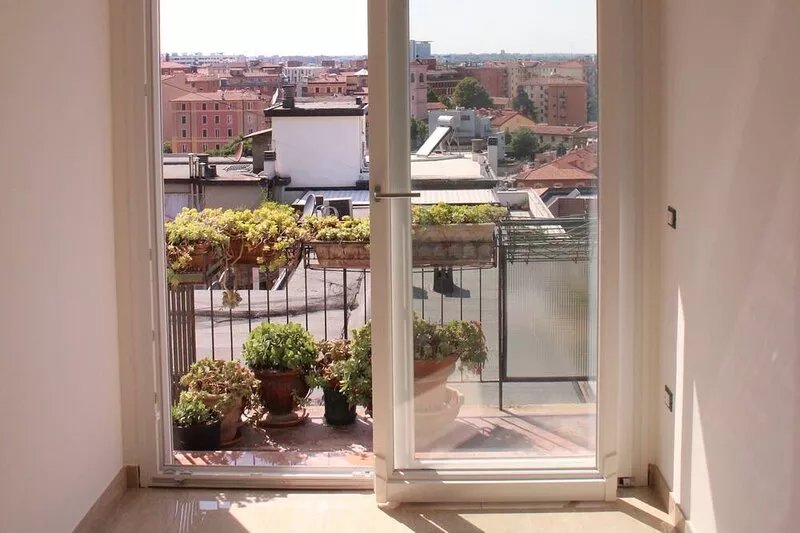 Contemporary apartment in the beating heart of Bologna with amazing skyline view