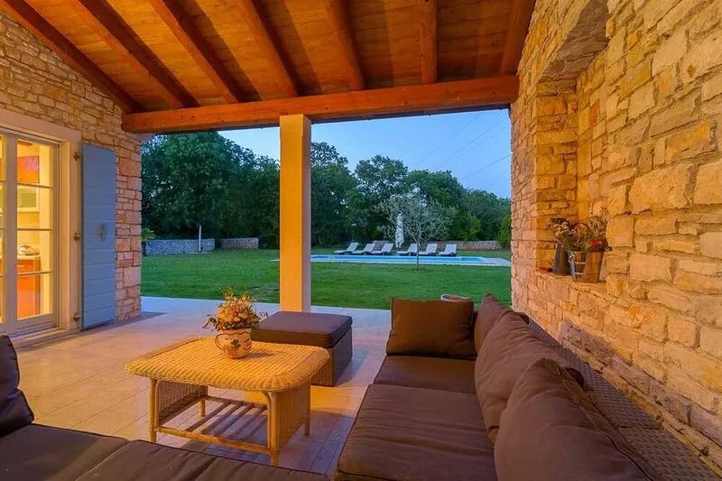 A traditional, stone villa in Marčana with a pool and children's playground