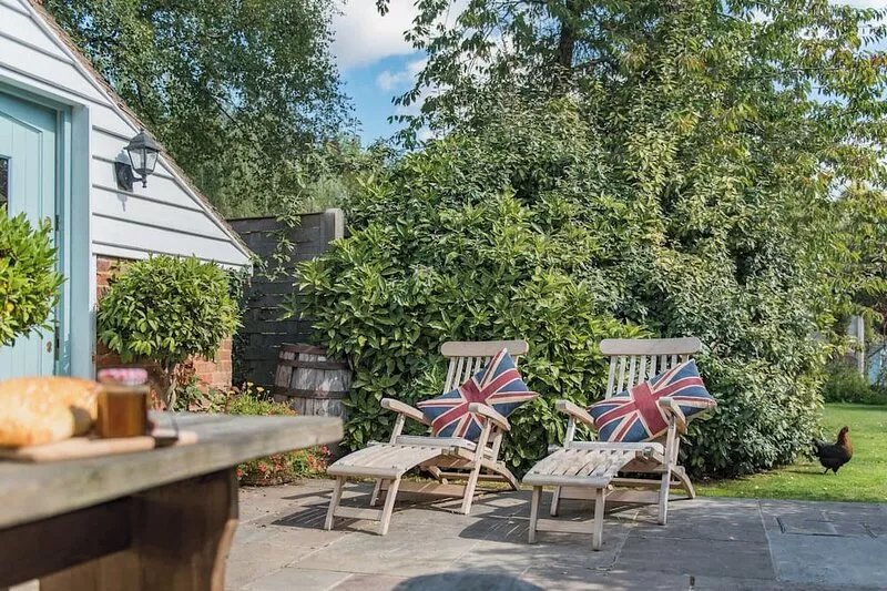 Pretty as a picture cottage tucked away at the end of a garden in stunning