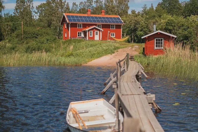 Holiday home on a lake property with a own bathing area, jetty and sauna