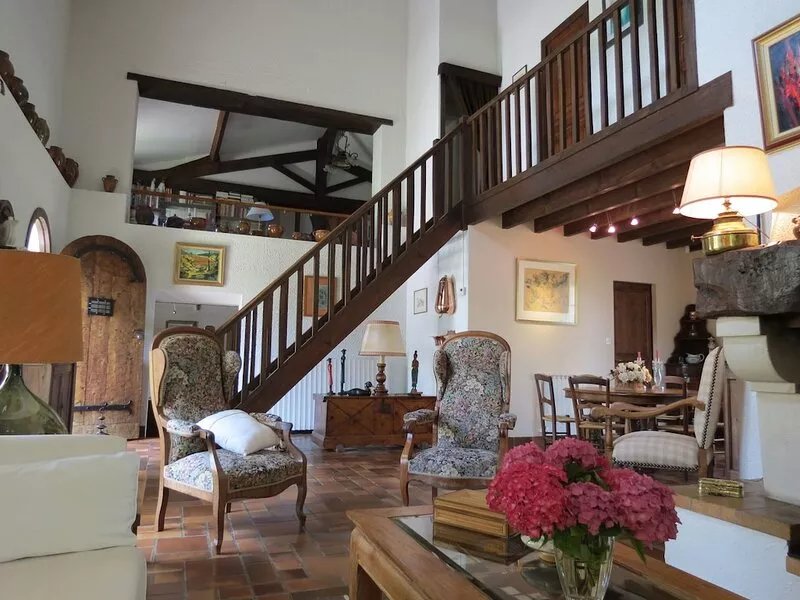 Charming stone house in a park with trees on the hillsides of Bordeaux