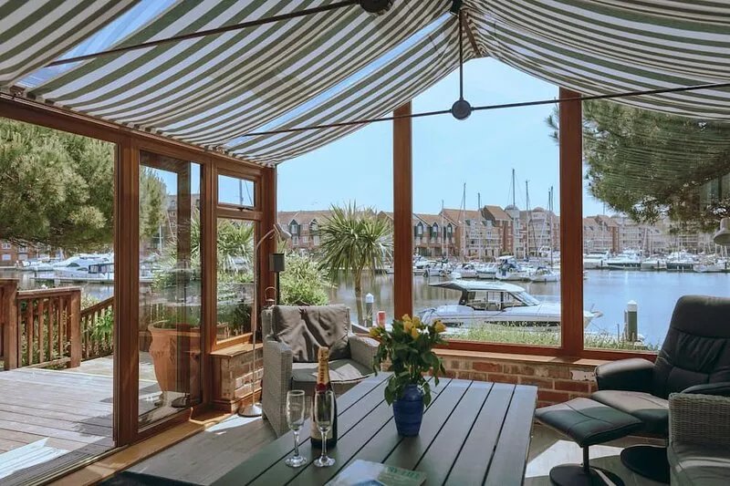 Stunning waterside six-bed house with water views, gardens and private jetty