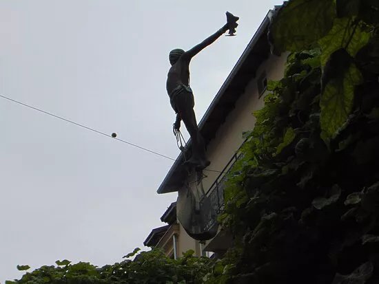 Statue Of A Tightrope Fisherman
