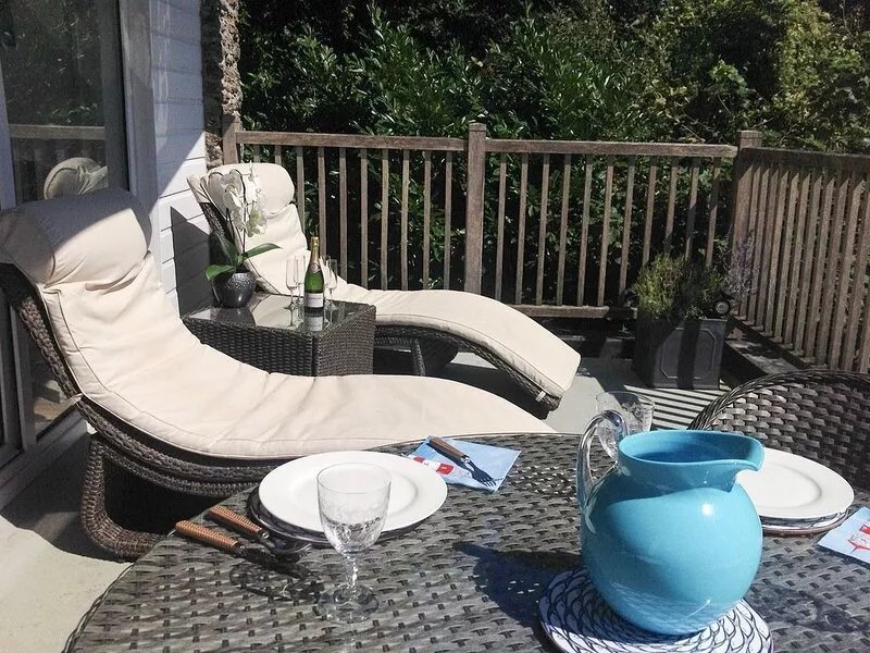 Excellent location, south facing balcony, private patio and designated parking