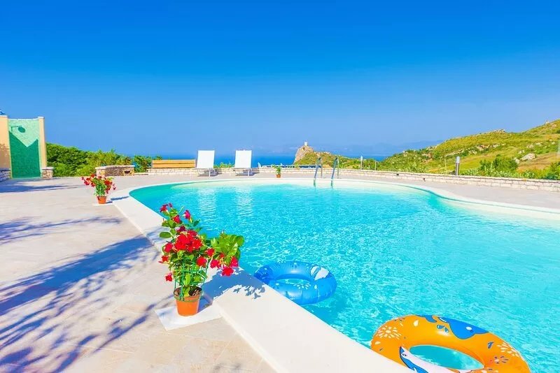 A balcony on the sea, gorgeous pool, park