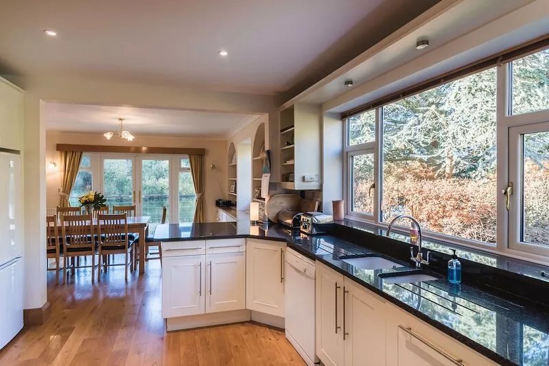 Luxury Lakeside Home In extensive grounds with boats, canoes and tennis court.