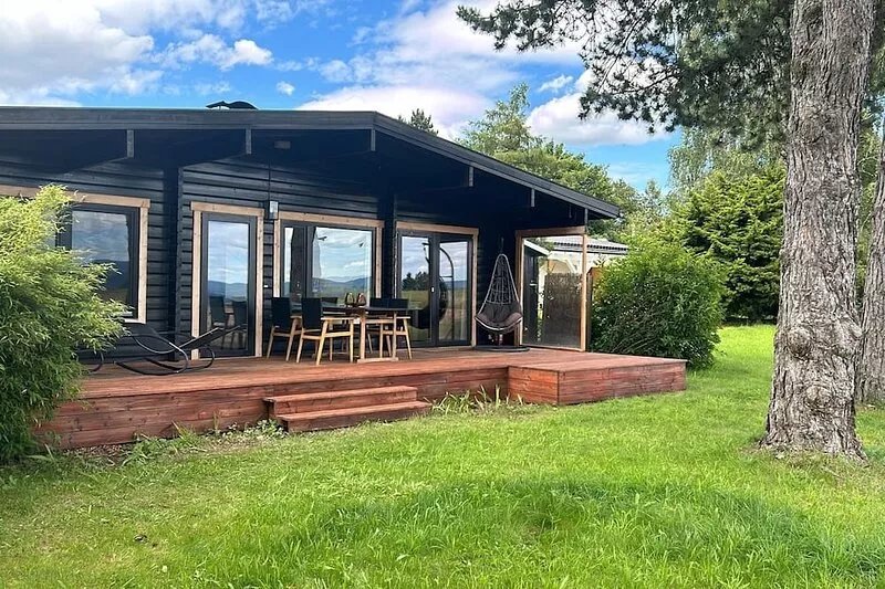 Quiet wooden house on the edge of a field
