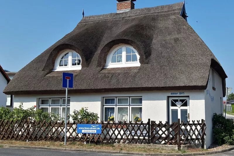 Nostalgia in a romantic holiday home with a thatched roof and fireplace in
