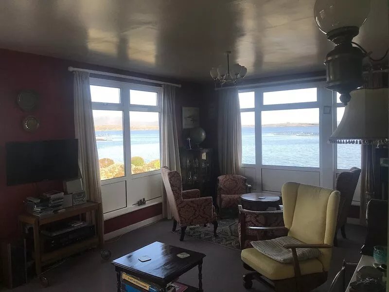 Right on the sea front bright bungalow with big secluded garden