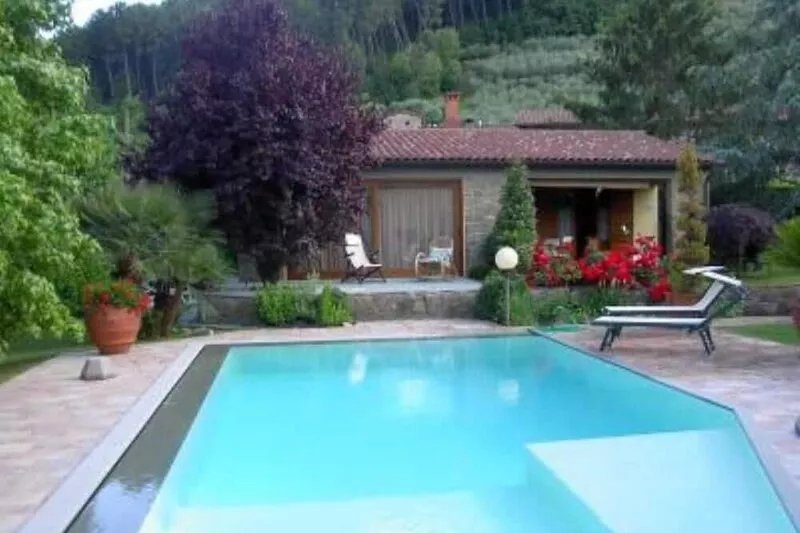 House with large veranda, garden and swimming pool