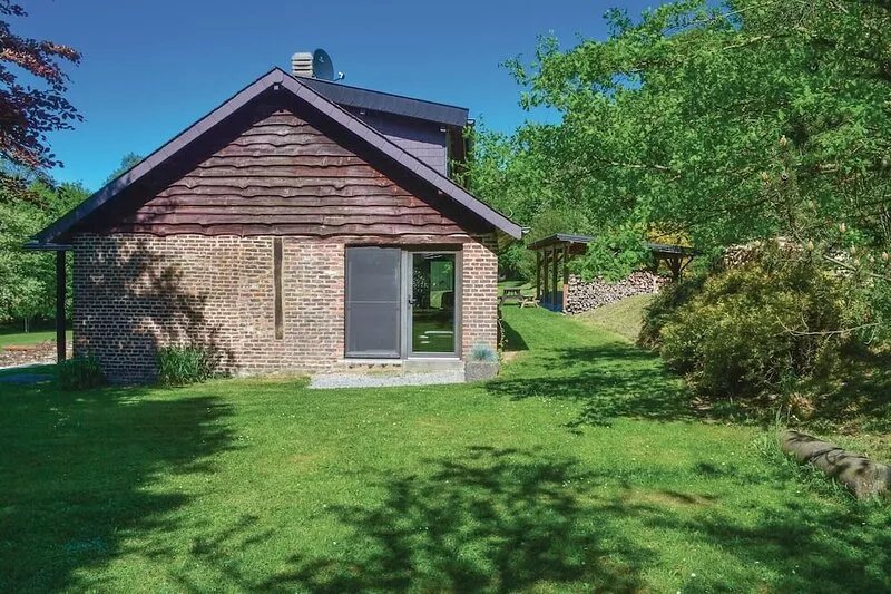 This holiday home is located in Beauraing on a 15,000 m² estate with a small