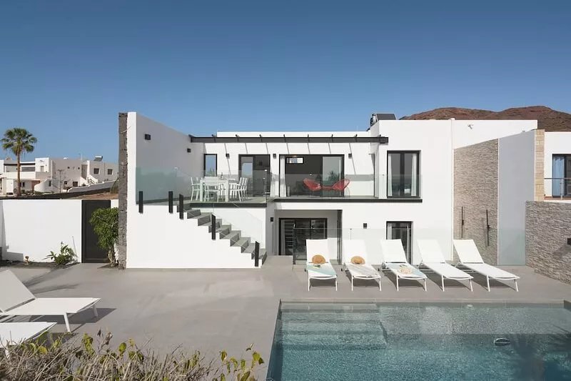 Sunset Sights | Modern ocean-view 4-bedroom villa with heated pool.