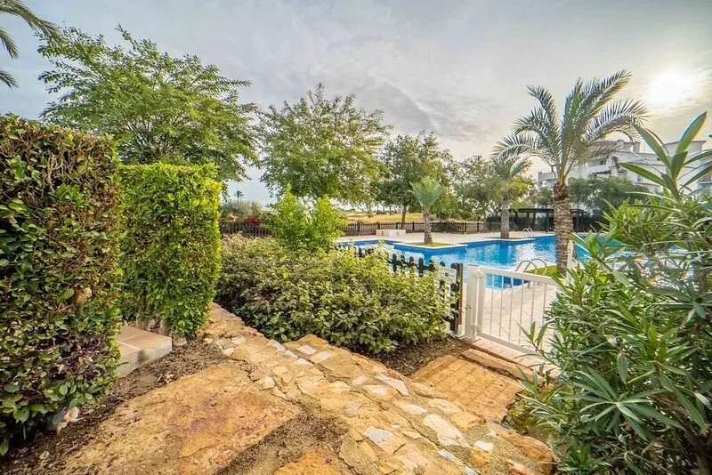 Perfectly located 2 bedroom ground floor golf course view poolside apartment