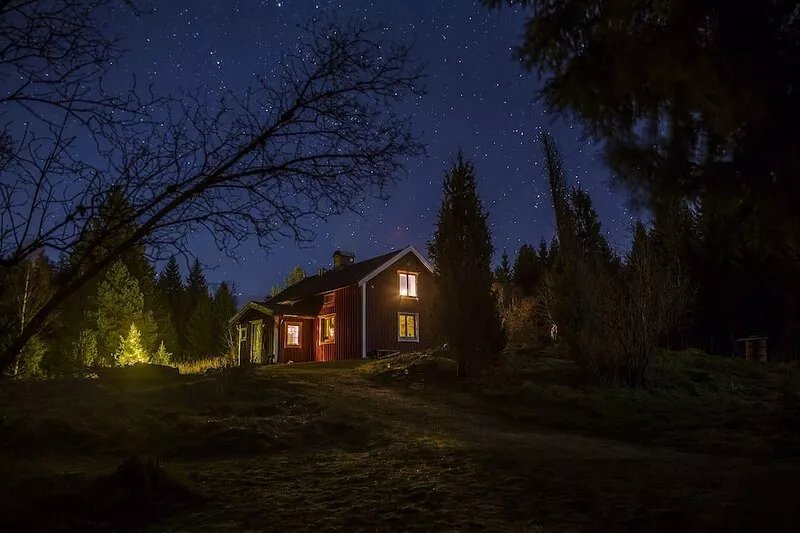 A genuine Swedish torp (forest cottage) on a very sunny hill
